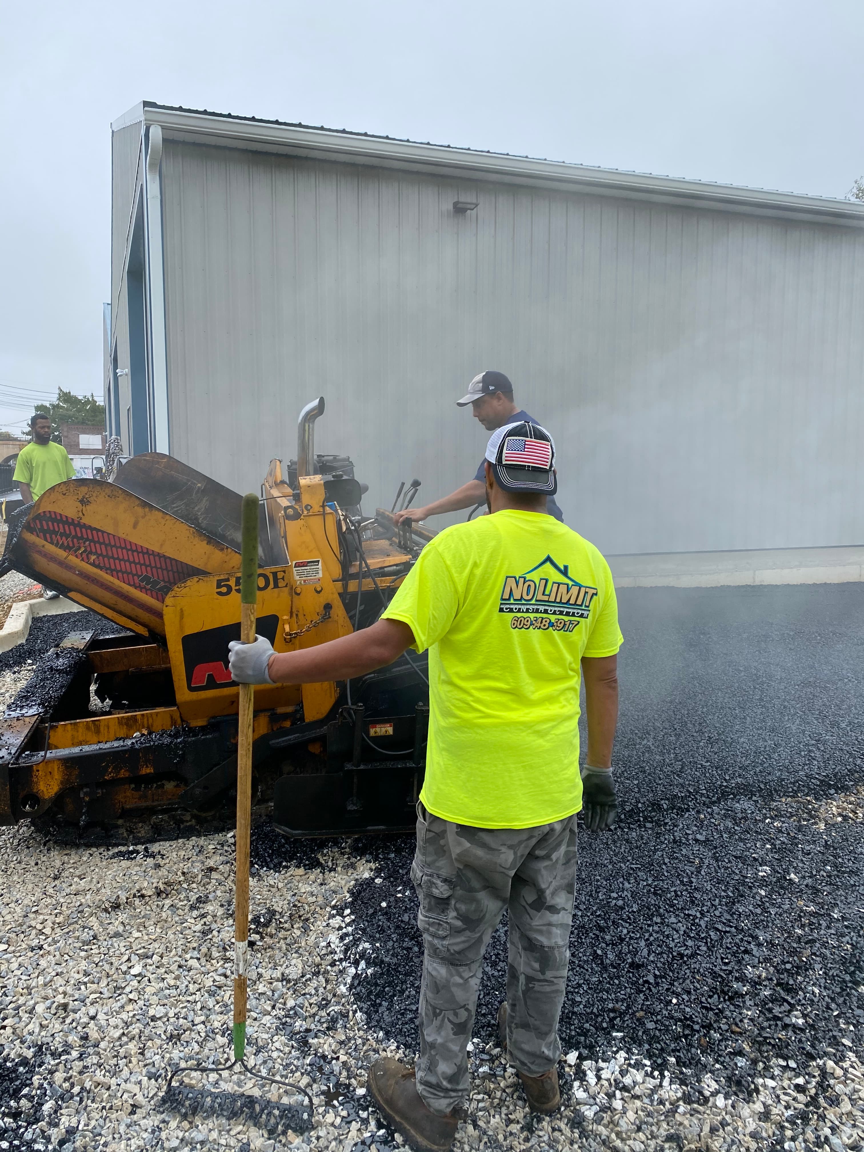 Asphalt paving machine crew